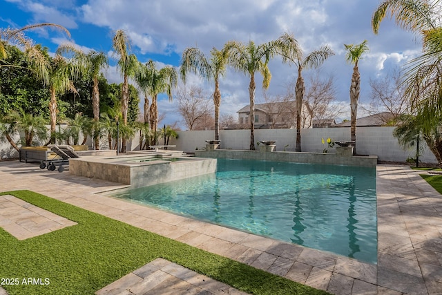 view of swimming pool featuring a patio and an in ground hot tub