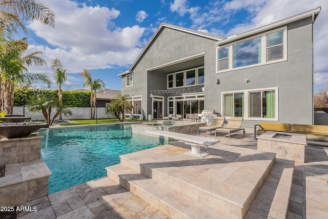 view of pool with area for grilling and a patio