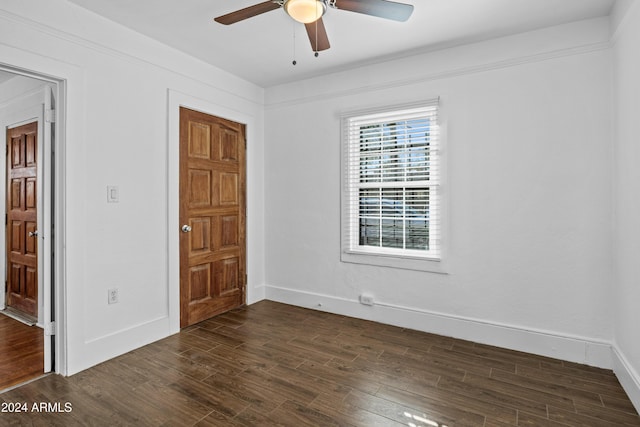 unfurnished room with ceiling fan and dark hardwood / wood-style floors