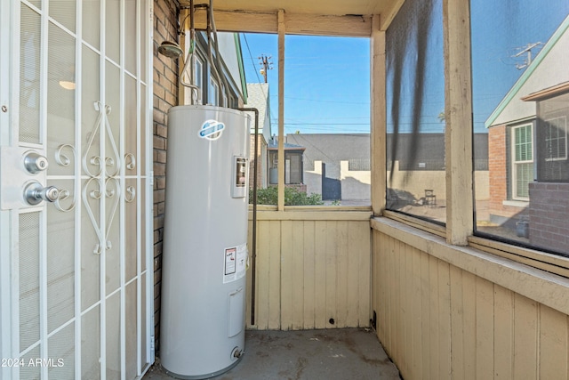 utility room with electric water heater