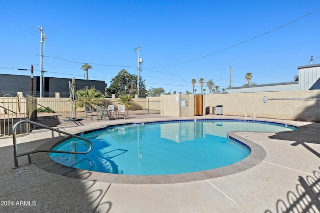 view of swimming pool featuring a patio area