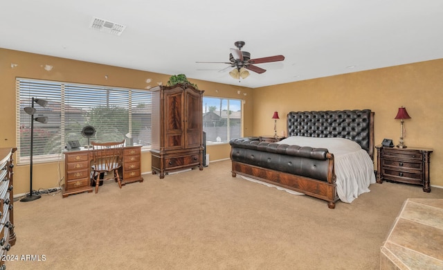 carpeted bedroom with ceiling fan