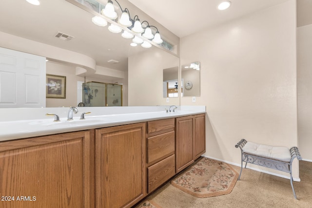 bathroom featuring an enclosed shower and vanity