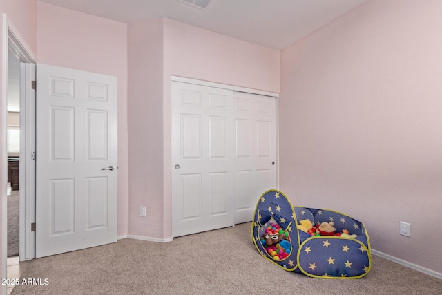 recreation room with light carpet