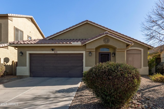 mediterranean / spanish-style house featuring a garage