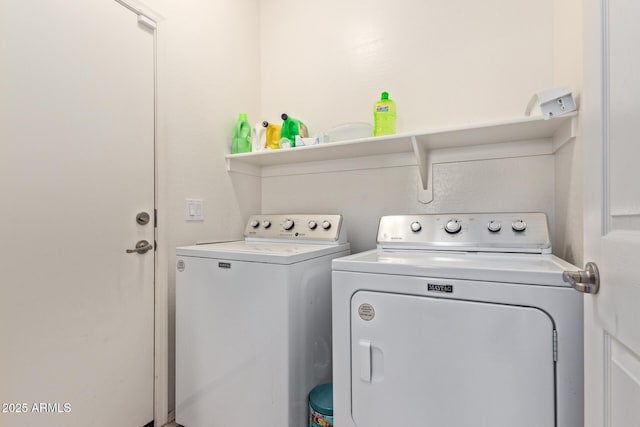 clothes washing area with washing machine and clothes dryer