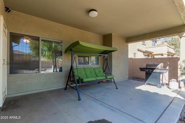 view of patio featuring a grill