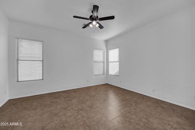 spare room with ceiling fan