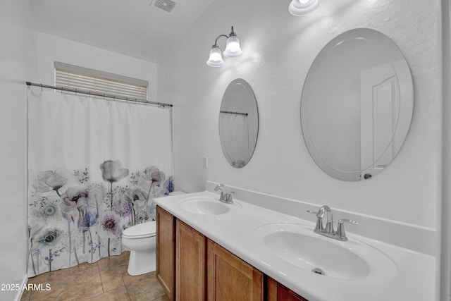 bathroom featuring vanity, toilet, and a shower with shower curtain