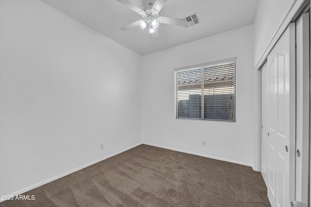 carpeted empty room with ceiling fan