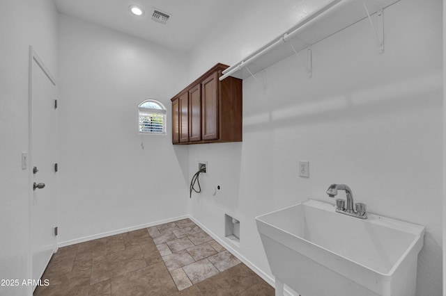 laundry area with cabinets, washer hookup, hookup for a gas dryer, and sink