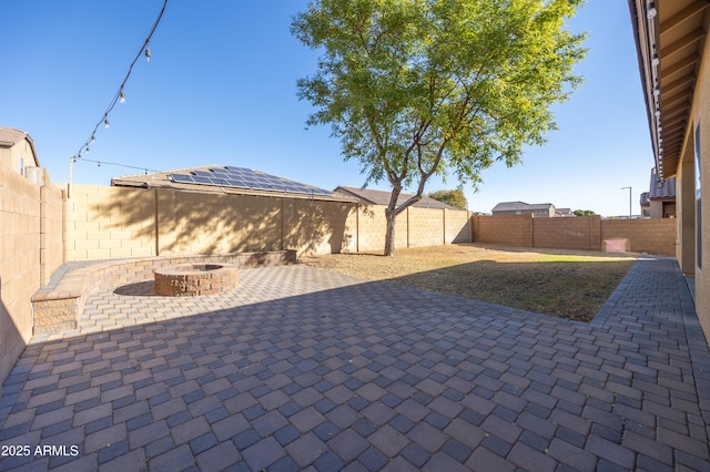 view of patio with an outdoor fire pit