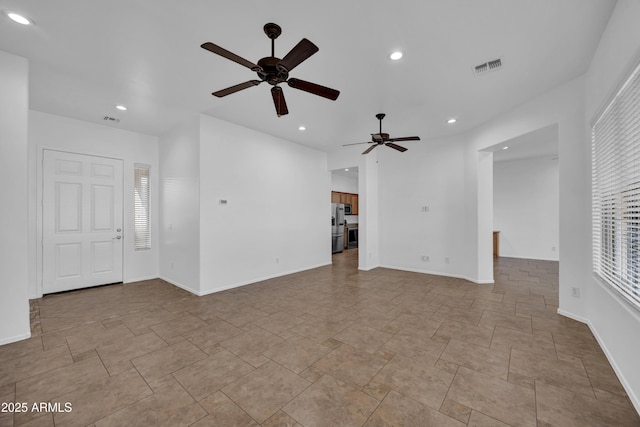 unfurnished living room with plenty of natural light and ceiling fan