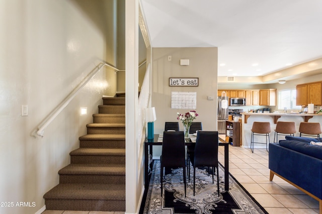 stairway featuring tile patterned floors