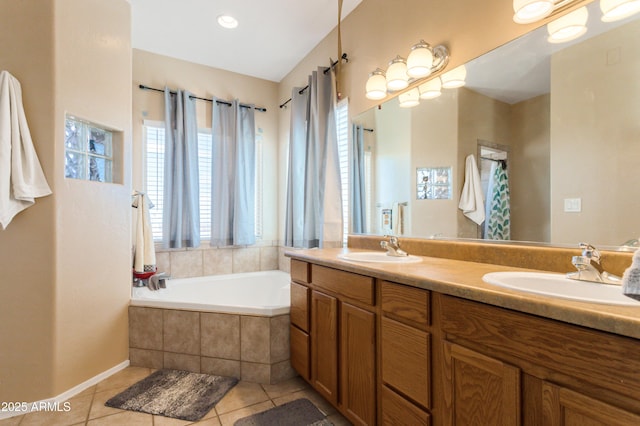 full bath with tile patterned flooring, double vanity, a sink, and a bath