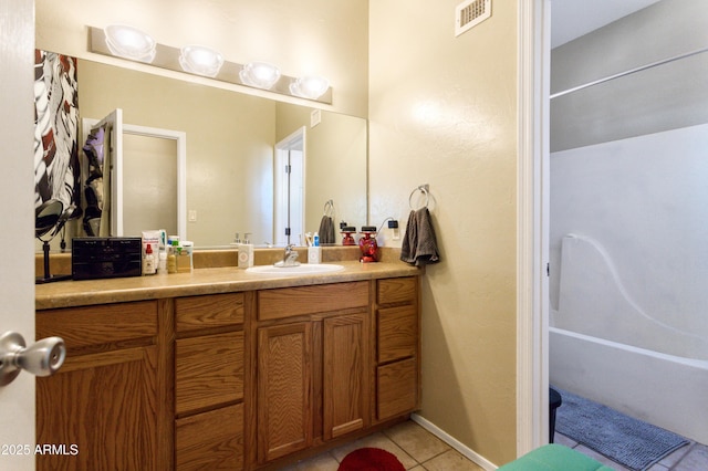 bathroom featuring tile patterned flooring, visible vents, and vanity