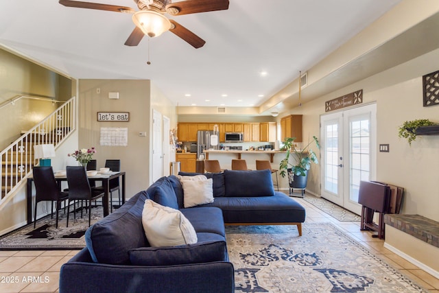 living room featuring recessed lighting, french doors, stairway, and light tile patterned floors