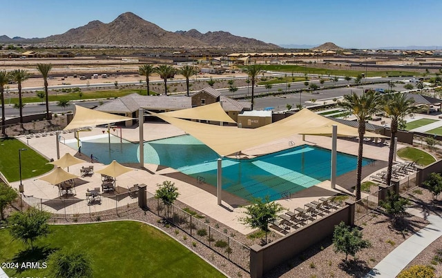 view of swimming pool featuring a mountain view