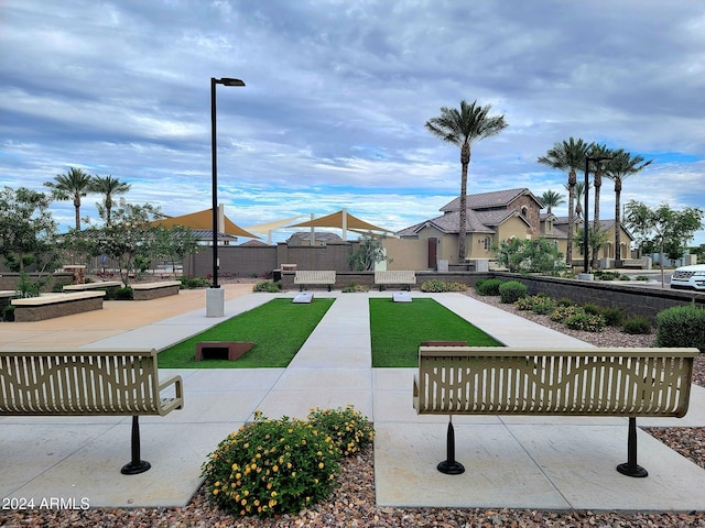 view of home's community featuring a lawn