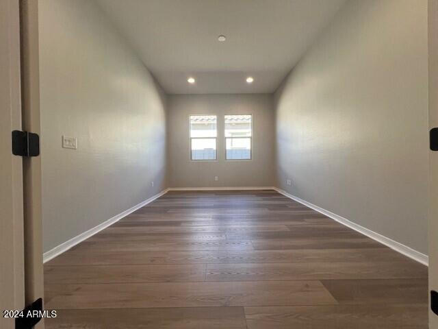 empty room featuring dark wood-type flooring