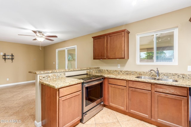 kitchen featuring kitchen peninsula, sink, light tile patterned flooring, light stone countertops, and stainless steel electric stove