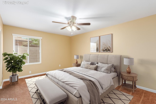 carpeted bedroom featuring ceiling fan