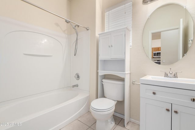 full bath with baseboards, toilet, bathtub / shower combination, tile patterned floors, and vanity