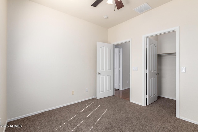 unfurnished bedroom featuring visible vents, carpet floors, and baseboards