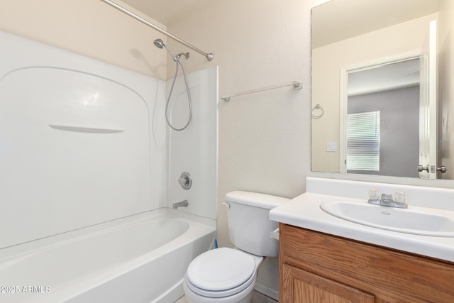 bathroom featuring vanity, toilet, and shower / washtub combination