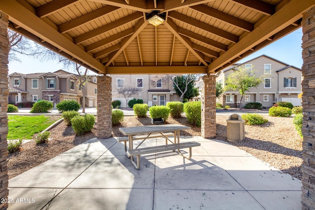 view of patio / terrace with a gazebo and a residential view