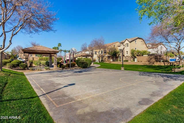 view of sport court with a gazebo, a lawn, a residential view, and community basketball court