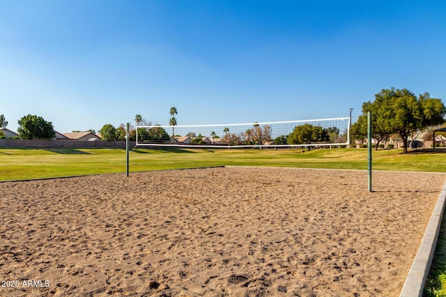 view of community featuring a yard and volleyball court