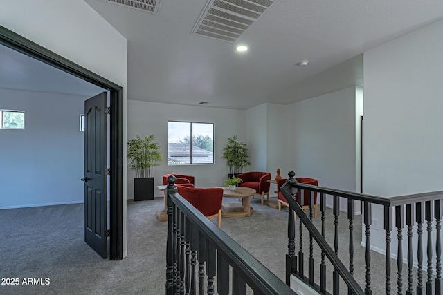 interior space featuring a wealth of natural light and carpet flooring