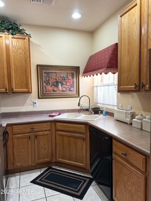 6535 E Superstition Springs Blvd Unit 217, Mesa, AZ 85206 - kitchen with black dishwasher, a sink, brown cabinetry, and recessed lighting