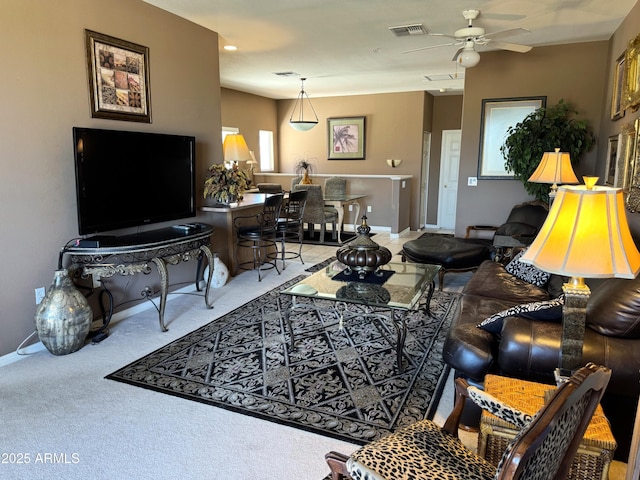 6535 E Superstition Springs Blvd Unit 217, Mesa, AZ 85206 - living area featuring a ceiling fan, baseboards, and carpet