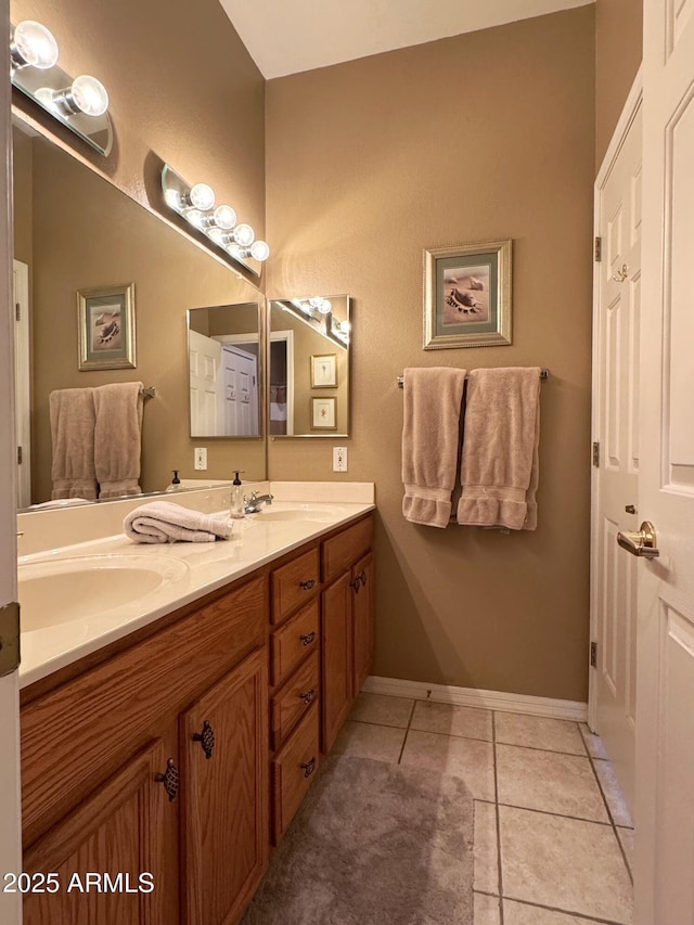 6535 E Superstition Springs Blvd Unit 217, Mesa, AZ 85206 - full bathroom with double vanity, tile patterned flooring, and baseboards