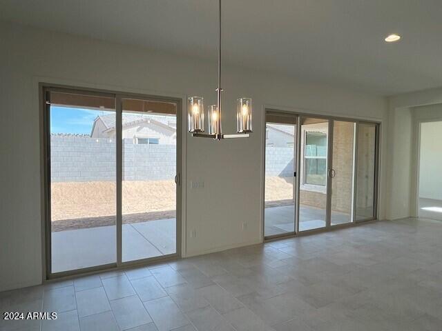 entryway featuring an inviting chandelier