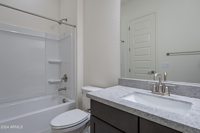 full bathroom featuring vanity, washtub / shower combination, and toilet