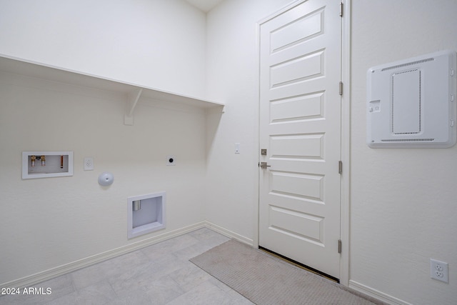 clothes washing area featuring gas dryer hookup, washer hookup, and electric dryer hookup