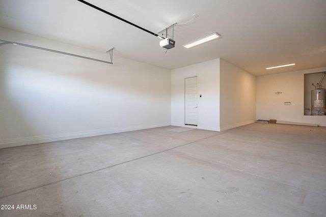 garage featuring a garage door opener and gas water heater