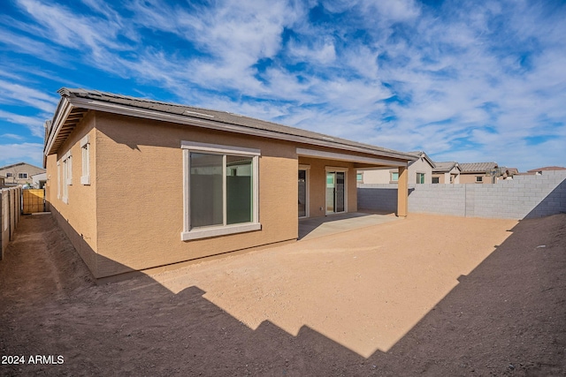 rear view of house featuring a patio