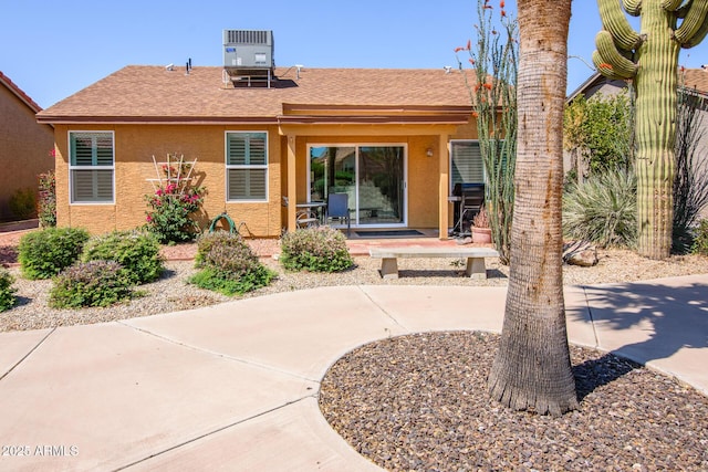 6831 S Coral Gable Dr, Chandler, AZ 85249 - back of property with stucco siding, central AC, a shingled roof, and a patio area