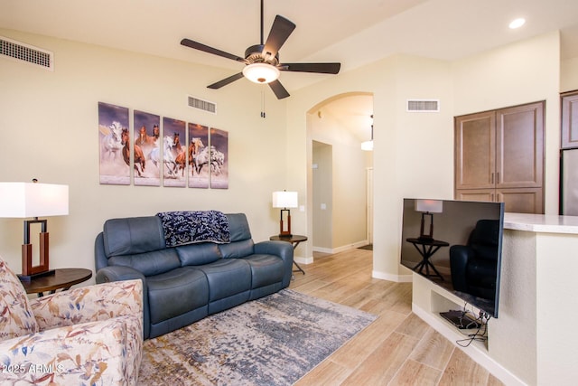6831 S Coral Gable Dr, Chandler, AZ 85249 - living room with arched walkways, a ceiling fan, light wood-style flooring, baseboards, and recessed lighting