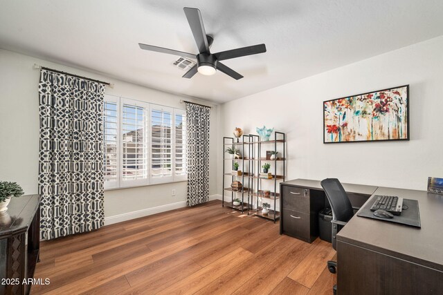 3665 S Jojoba Way, Chandler, AZ 85248 - home office featuring ceiling fan, light wood-type flooring, and baseboards