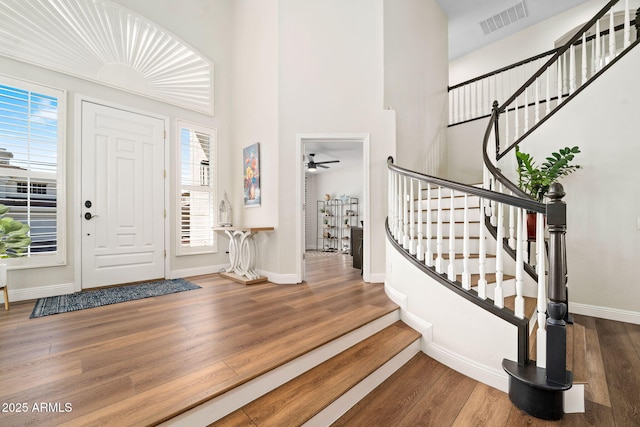 3665 S Jojoba Way, Chandler, AZ 85248 - entryway featuring wood finished floors, plenty of natural light, baseboards, and a towering ceiling