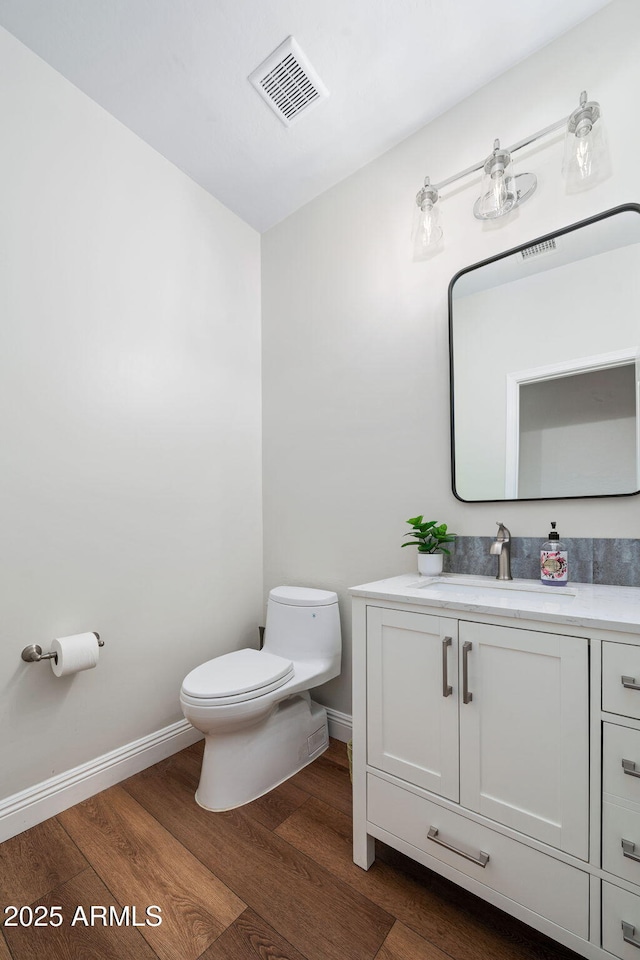 3665 S Jojoba Way, Chandler, AZ 85248 - bathroom featuring toilet, wood finished floors, vanity, and baseboards