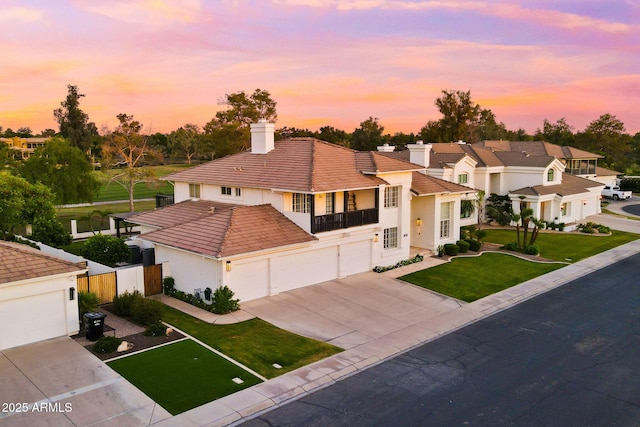 3665 S Jojoba Way, Chandler, AZ 85248 - mediterranean / spanish house featuring concrete driveway, a tiled roof, stucco siding, and a balcony