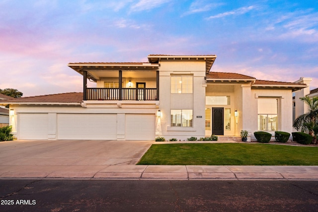 3665 S Jojoba Way, Chandler, AZ 85248 - mediterranean / spanish-style home with a balcony, a tiled roof, stucco siding, driveway, and a front lawn