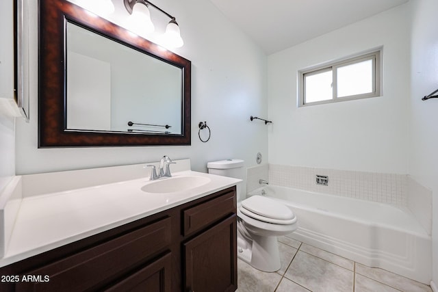 full bathroom featuring toilet, a tub to relax in, vanity, and tile patterned flooring