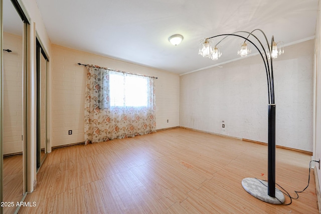 interior space with a chandelier and ornamental molding